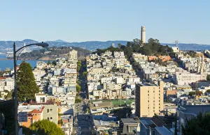 San Francisco California hills of the city and Coit Tower in sunshine with streets San Francisco California hills of the city and Coit Tower in sunshine with streets