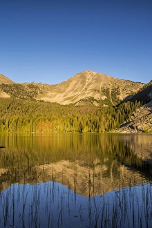 Sawtooth Mountain reflects into calm Sawtooth Lake in the Pioneers Mountains Sawtooth Mountain reflects into calm Sawtooth Lake in the Pioneers Mountains