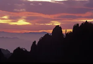 Silhouette of Mt. Huangshan (Yellow Mountain) at sunset, Anhui Province, China Silhouette of Mt. Huangshan (Yellow Mountain) at sunset, Anhui Province, China