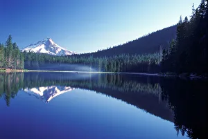 Small boat on Frog Lake with Mt. Hood in background, Oregon Small boat on Frog Lake with Mt. Hood in background, Oregon