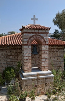 Small Greek Orthodox church right next to new Acropolis Museum in downtown Athens Greece Small Greek Orthodox church right next to new Acropolis Museum in downtown Athens Greece