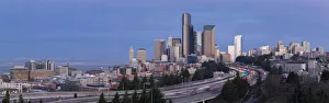 Soft morning light on downtown Seattle with snowcapped Olympic mountains in the distance Soft morning light on downtown Seattle with snowcapped Olympic mountains in the distance