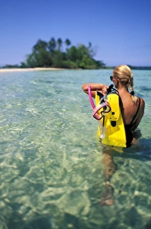 Solomon Islands, Nggaranomah Island. Woman with diving gear (MR) Solomon Islands, Nggaranomah Island. Woman with diving gear (MR)