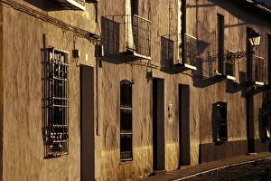 Spain, Almagro, Castile-La Mancha Cobblestone street with traditional houses Spain, Almagro, Castile-La Mancha Cobblestone street with traditional houses