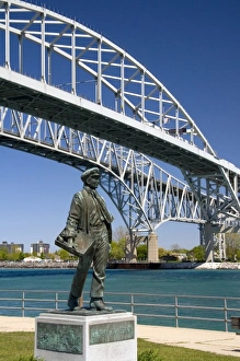 A statue of Thomas Edison by local artist Mino Duffy sits below the Blue Water Bridge along the St A statue of Thomas Edison by local artist Mino Duffy sits below the Blue Water Bridge along the St