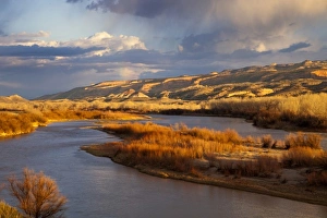 Stormy light over the Colorado River and Colorado National Monument near Fruita, Colorado Stormy light over the Colorado River and Colorado National Monument near Fruita, Colorado