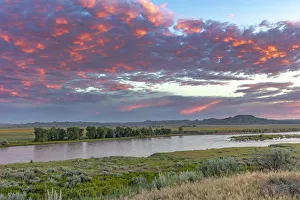 Sunrise and clouds over the Yellowstone River at the confluence with the Powder River Sunrise and clouds over the Yellowstone River at the confluence with the Powder River