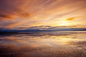 Sunset over Great Salt Lake looking west toward Lakeside Mountains and Stansbury Island Sunset over Great Salt Lake looking west toward Lakeside Mountains and Stansbury Island