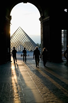 Sunset behind the Louvre Pyramid, Paris, France Sunset behind the Louvre Pyramid, Paris, France