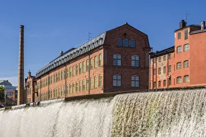 Sweden, Norrkoping, early Swedish industrial town, factory buildings and waterfall Sweden, Norrkoping, early Swedish industrial town, factory buildings and waterfall