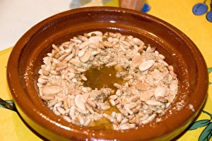 Tangier Morocco honey and almond dessert in a clay dish at a restaurant Tangier Morocco honey and almond dessert in a clay dish at a restaurant