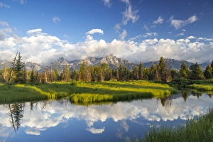 Teton mountains relfect in Schwabacher Landing on the Snake River in Grand Teton National Teton mountains relfect in Schwabacher Landing on the Snake River in Grand Teton National