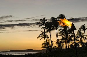 Tiki torches at Sunset on Poipu beach Kauai, Hawaii Tiki torches at Sunset on Poipu beach Kauai, Hawaii