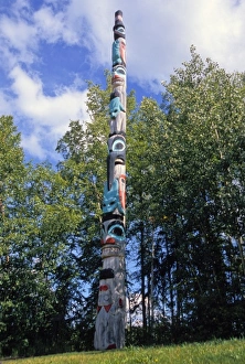 Tlingit carved and painted wooden totem pole on display at the University of Alaska Tlingit carved and painted wooden totem pole on display at the University of Alaska