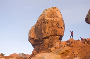 A tourist checks out one of the Twins rock formation in Capitol Reef National Park A tourist checks out one of the Twins rock formation in Capitol Reef National Park