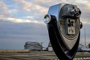 Tourist telescope looking out at an amusement park, Wildwood, New Jersey, USA Tourist telescope looking out at an amusement park, Wildwood, New Jersey, USA