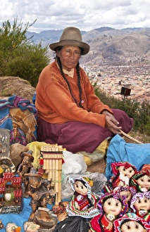 Traditional woman with colorful clothes selling souvenirs in religious region Saqsayhuaman Traditional woman with colorful clothes selling souvenirs in religious region Saqsayhuaman