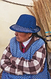 Traditional woman in costume selling brooms in Cuzco Cusco Peru (MR) Traditional woman in costume selling brooms in Cuzco Cusco Peru (MR)
