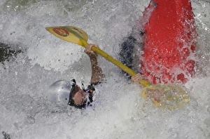 USA, Colorado, Arkansas River, Salida. Female kayaker in a river hydraulic called USA, Colorado, Arkansas River, Salida. Female kayaker in a river hydraulic called