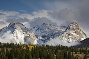 USA, Colorado, San Juan Mountains, Uncompahgre National Forest. Clouds swirl around USA, Colorado, San Juan Mountains, Uncompahgre National Forest. Clouds swirl around