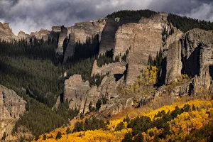 USA, Colorado, West Elk Mountains. Sunrise storm clouds above mountain and forest in autumn USA, Colorado, West Elk Mountains. Sunrise storm clouds above mountain and forest in autumn