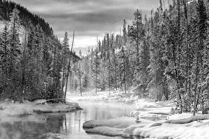 USA, Gibbon River, Yellowstone National Park. Steam rises from the Gibbon River in winter USA, Gibbon River, Yellowstone National Park. Steam rises from the Gibbon River in winter
