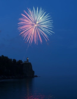 USA, Minnesota, Two Harbors, Split Rock Lighthouse, Fireworks celebrate the lights USA, Minnesota, Two Harbors, Split Rock Lighthouse, Fireworks celebrate the lights