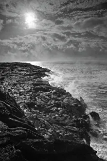 USA. Molten lava flows into the ocean at sunrise in Volcanoes NP on the Big Island of Hawaii USA. Molten lava flows into the ocean at sunrise in Volcanoes NP on the Big Island of Hawaii