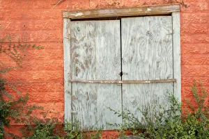 USA, New Mexico, Taos. Mission Ranchos de Taos, Colorful orange wall and weathered USA, New Mexico, Taos. Mission Ranchos de Taos, Colorful orange wall and weathered
