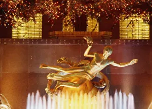 USA, New York, New York City, Statue of Prometheus, Rockafller Center December Evening USA, New York, New York City, Statue of Prometheus, Rockafller Center December Evening
