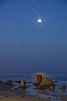 USA, Oregon, Bandon Beach. Lunar eclipse at night USA, Oregon, Bandon Beach. Lunar eclipse at night