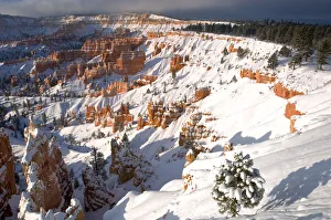 USA, Utah, Bryce Canyon National Park. Winter sunrise on snow-covered landscape USA, Utah, Bryce Canyon National Park. Winter sunrise on snow-covered landscape