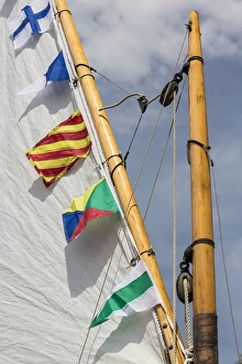 USA, Washington. Boat sail and flags at Bainbridge Island Wooden Boat Festival. Credit as USA, Washington. Boat sail and flags at Bainbridge Island Wooden Boat Festival. Credit as
