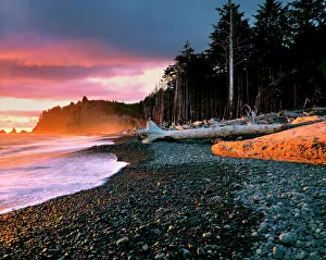 USA, Washington State, Olympic NP. Waves lap the rocky beach at sunset at Rialto Beach USA, Washington State, Olympic NP. Waves lap the rocky beach at sunset at Rialto Beach