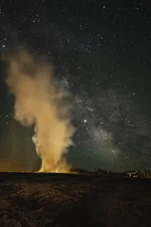 USA, Wyoming, Yellowstone National Park. Milky Way and erupting Old Faithful Geyser USA, Wyoming, Yellowstone National Park. Milky Way and erupting Old Faithful Geyser