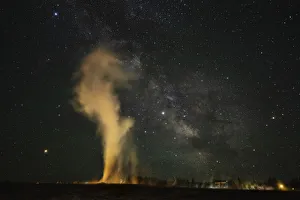 USA, Wyoming, Yellowstone National Park. Milky Way and erupting Old Faithful Geyser USA, Wyoming, Yellowstone National Park. Milky Way and erupting Old Faithful Geyser