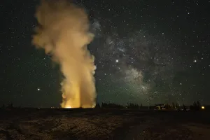 USA, Wyoming, Yellowstone National Park. Milky Way over an erupting Old Faithful Geyser USA, Wyoming, Yellowstone National Park. Milky Way over an erupting Old Faithful Geyser