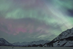 A vibrant display of Aurora Borealis fills the northern sky with a rainbow of colors A vibrant display of Aurora Borealis fills the northern sky with a rainbow of colors