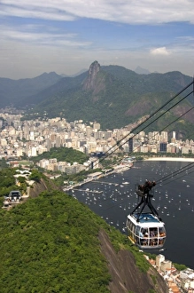 View of Rio de Janeiro and a cable car on Sugarloaf Peak, Brazil View of Rio de Janeiro and a cable car on Sugarloaf Peak, Brazil
