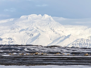 View over the Skeitherarsandur during winter towards snow capped volcano Vatnojoekull View over the Skeitherarsandur during winter towards snow capped volcano Vatnojoekull