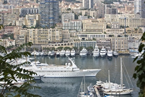 View of world famous harbor and city of with many large yachets. Monte-Carlo in Monaco View of world famous harbor and city of with many large yachets. Monte-Carlo in Monaco