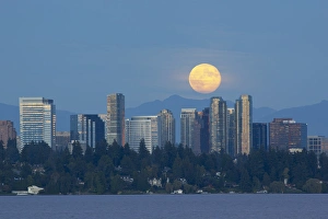 WA, Bellevue, Full moon raising over downtown skyline WA, Bellevue, Full moon raising over downtown skyline