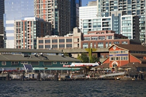 WA, Seattle, Piers 55 and 56 on Elliott Bay with Seattle skyline WA, Seattle, Piers 55 and 56 on Elliott Bay with Seattle skyline