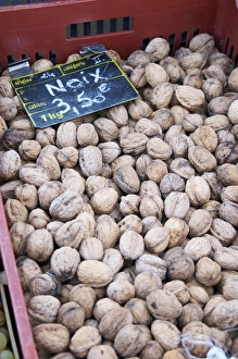 Walnuts for sale at a market stall at the market in Bergerac for 3.50 euro per kilo Walnuts for sale at a market stall at the market in Bergerac for 3.50 euro per kilo