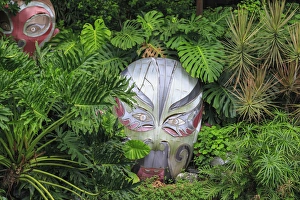 warrior masks in lush green tropical foliage, Lichi Bay Walkway and Park, Guangzhou warrior masks in lush green tropical foliage, Lichi Bay Walkway and Park, Guangzhou