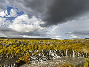 Waterfall Hraunfossar with colorful foliage during fall. Northern Iceland Waterfall Hraunfossar with colorful foliage during fall. Northern Iceland