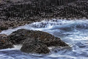Waves crash into basalt at the Giants Causeway in County Antrim, Northern Ireland Waves crash into basalt at the Giants Causeway in County Antrim, Northern Ireland