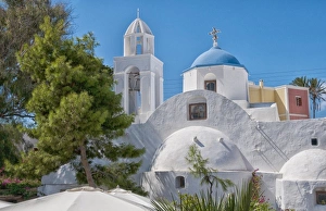 White curved colorful buildings in small traditional village near Kamari in Santorini White curved colorful buildings in small traditional village near Kamari in Santorini