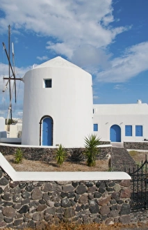 White windmill house in town in valley of Fira in Santorina Greece in Greek Islands White windmill house in town in valley of Fira in Santorina Greece in Greek Islands