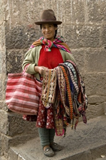 Woman with weavings to sell, Cuzco, Peru. (MR) Woman with weavings to sell, Cuzco, Peru. (MR)